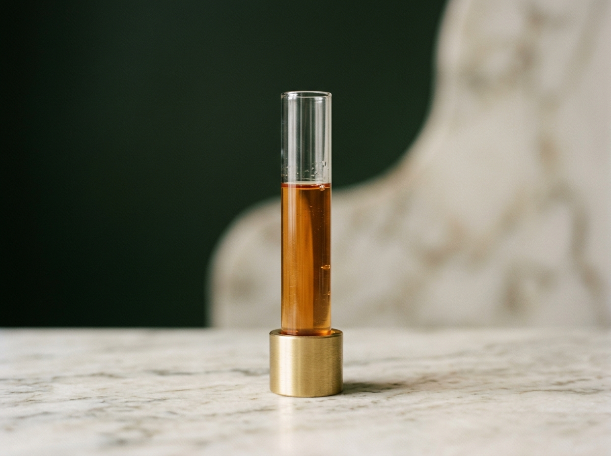 A tall glass apothecary vessel of luminous amber liquid on forest-green linen — plasmapheresis and exosomes at Aesura Health